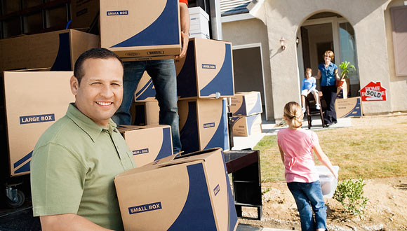 A happy family moving into their new home after a home inspection.